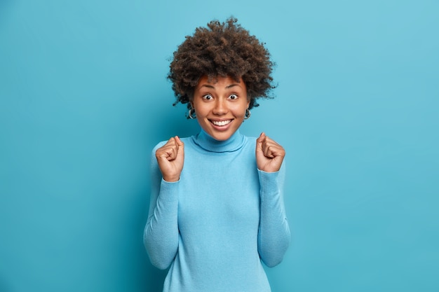 Young beautiful woman with curly hair isolated