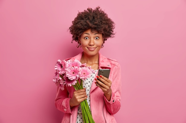 Young beautiful woman with curly hair isolated