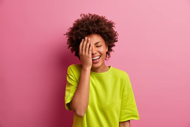 Young beautiful woman with curly hair isolated