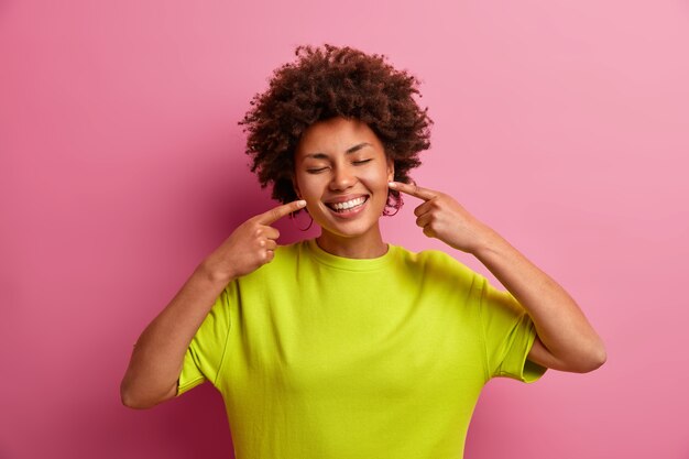 Young beautiful woman with curly hair isolated