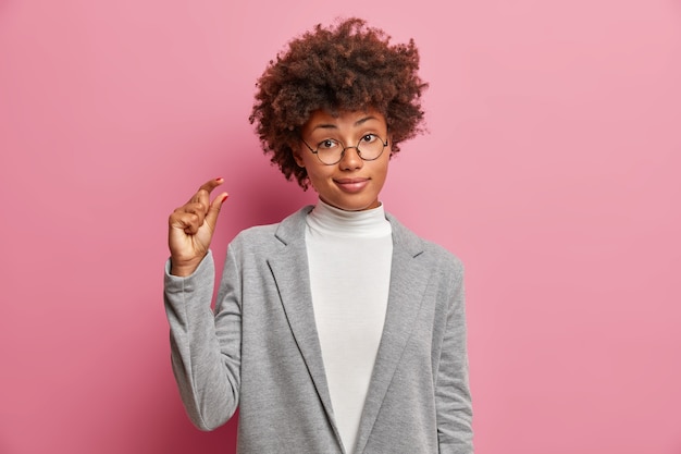 Young beautiful woman with curly hair isolated