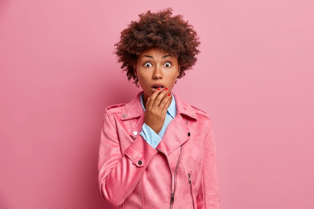 Young beautiful woman with curly hair isolated