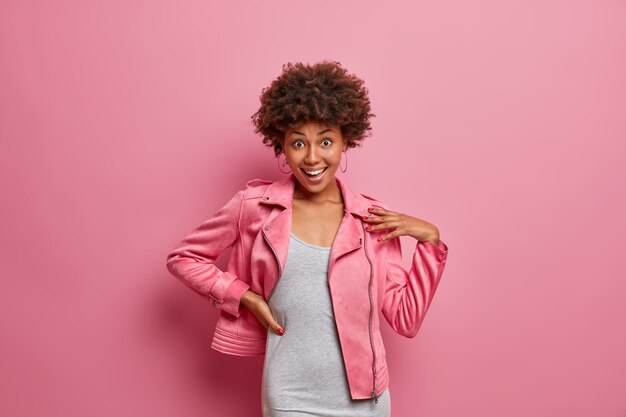 Young beautiful woman with curly hair isolated