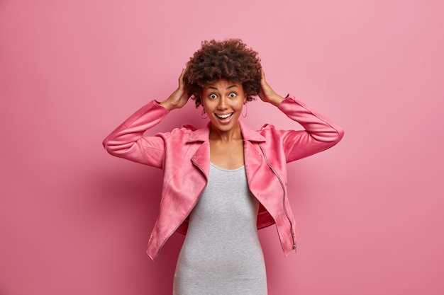 Young beautiful woman with curly hair isolated