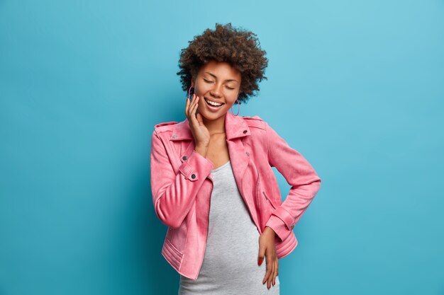 Young beautiful woman with curly hair isolated