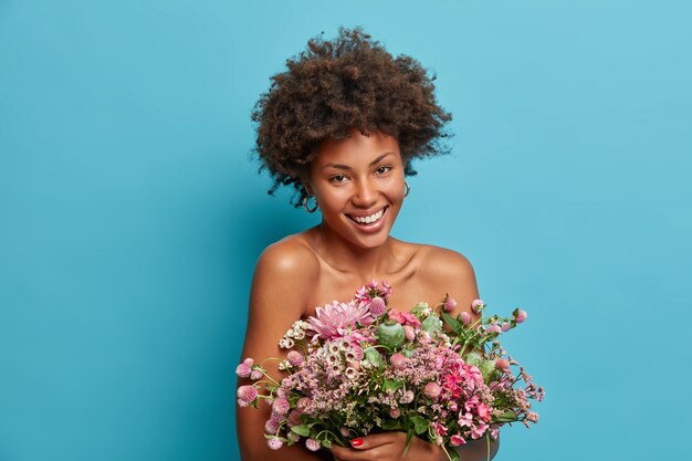 Young beautiful woman with curly hair isolated