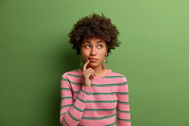 Free photo young beautiful woman with curly hair isolated