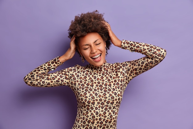 Young beautiful woman with curly hair isolated