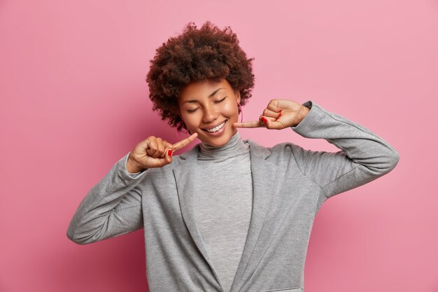 Young beautiful woman with curly hair isolated