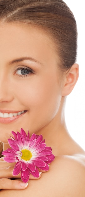 Young beautiful woman with flower 