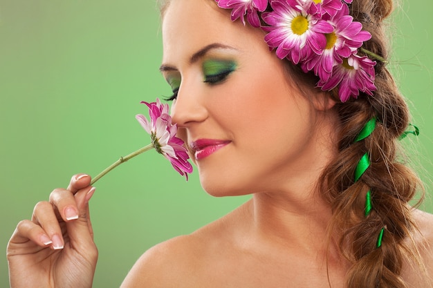 Young beautiful woman with flowers in hair