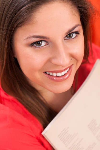 Free photo young beautiful woman with journal