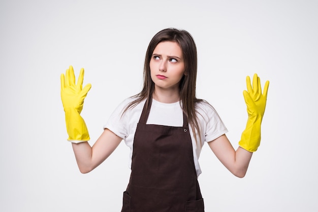 Young beautiful woman with raised hands wearing apron