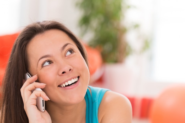 Young beautiful woman with smartphone