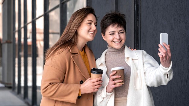 Young beautiful women using mobile