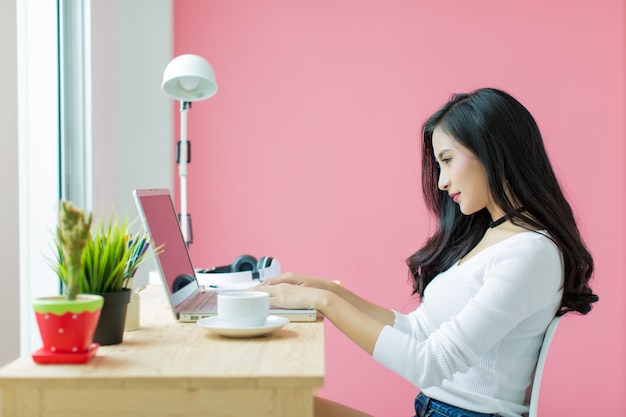 young beautiful working at computer desk