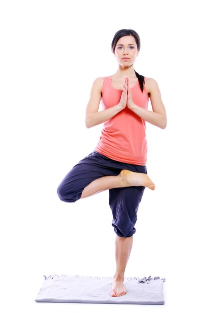 Young and beutiful girl doing yoga exercises