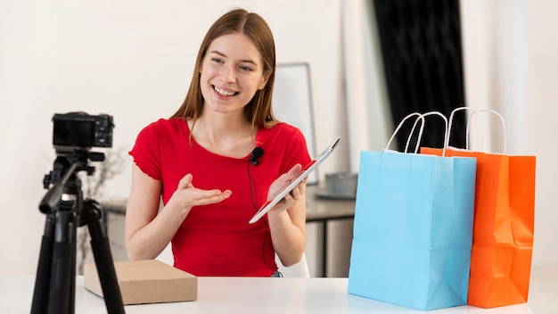 Young blogger unboxing shopping on camera