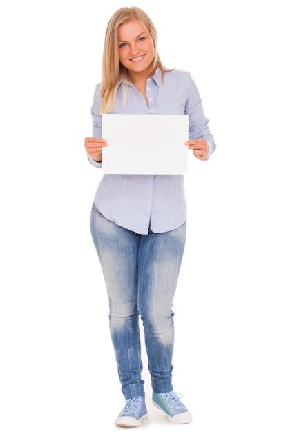 Young blond woman showing paper