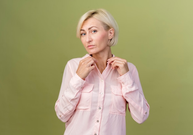 young blonde slavic woman holding collar 