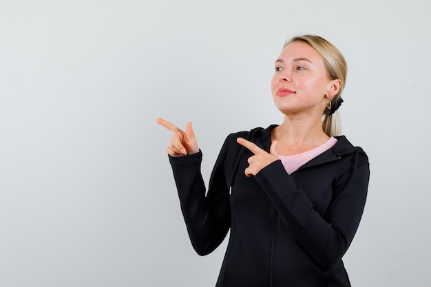 Young blonde woman in a black jacket