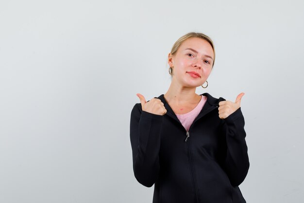 Young blonde woman in a black jacket