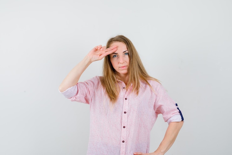 Free Photo young blonde woman in a casual pink shirt