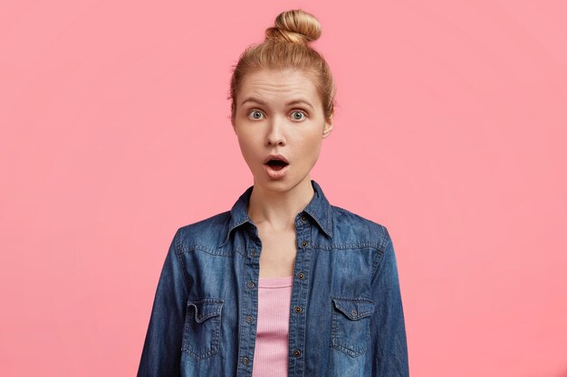 Young blonde woman in denim shirt