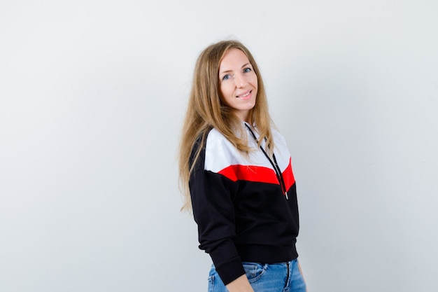 Young blonde woman in a jacket and jeans