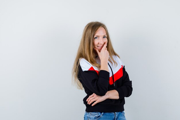 Free photo young blonde woman in a jacket and jeans