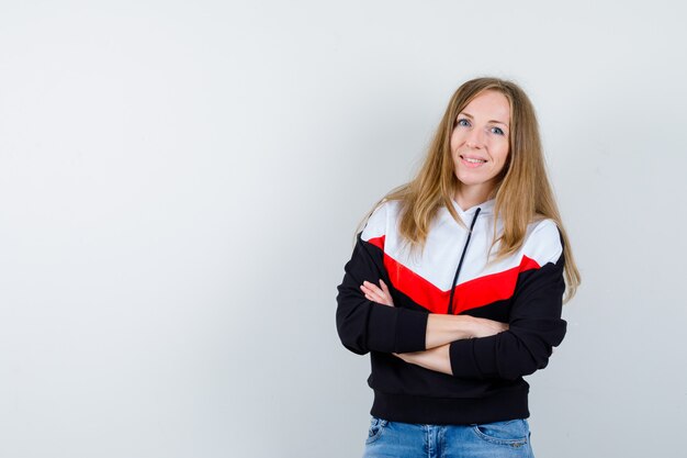 Young blonde woman in a jacket and jeans