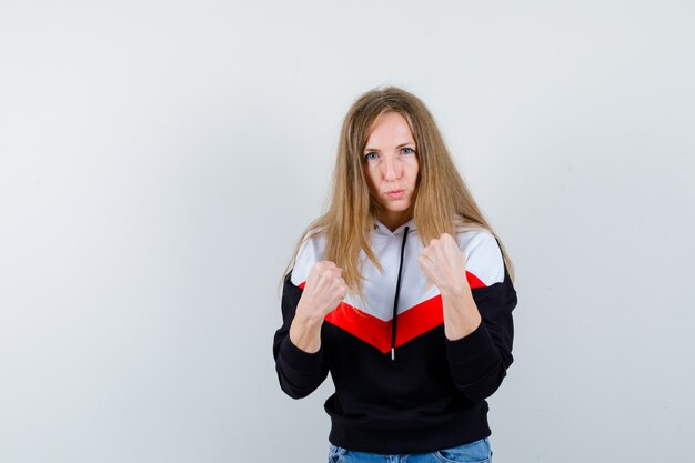 Young blonde woman in a jacket and jeans