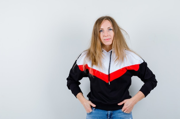 Young blonde woman in a jacket and jeans