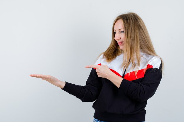 Young blonde woman in a jacket and jeans