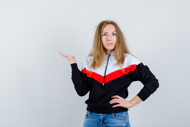 Young blonde woman in a jacket and jeans