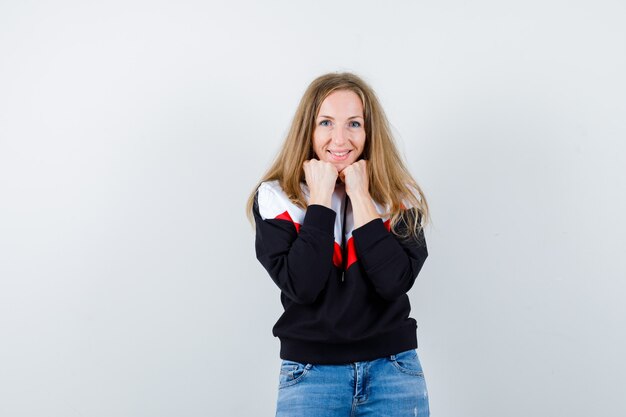 Young blonde woman in a jacket and jeans