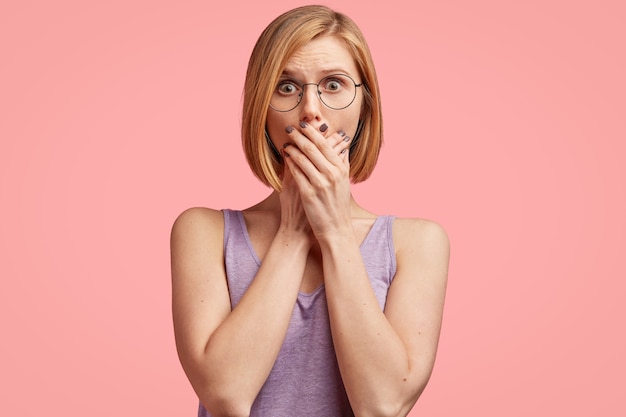 Young blonde woman in purple top