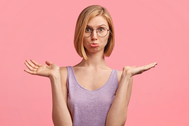 Young blonde woman in purple top