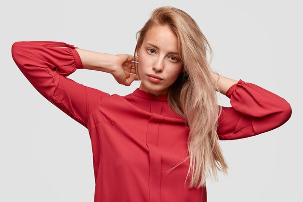 Young blonde woman in red shirt