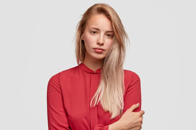 Young blonde woman in red shirt