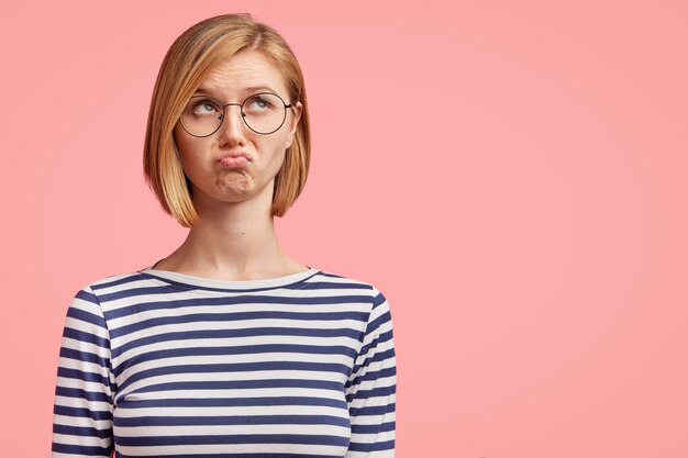 Young blonde woman in striped shirt