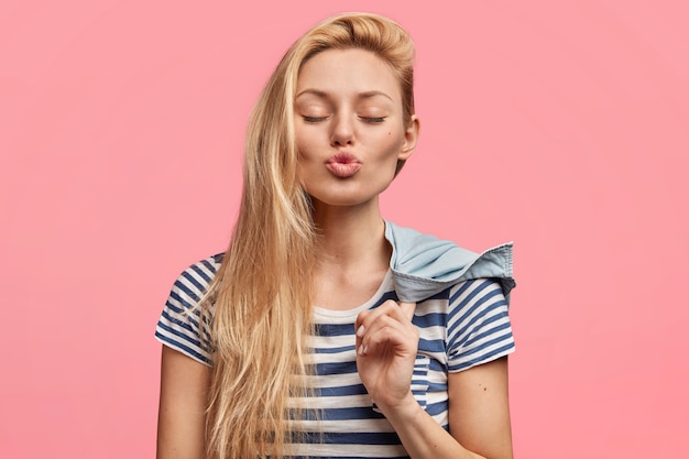 Young blonde woman in striped shirt