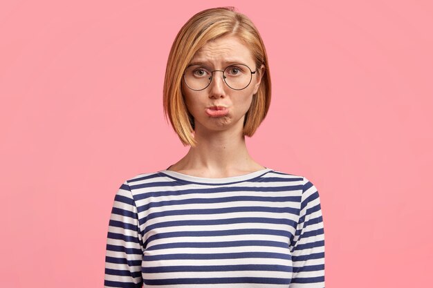 Young blonde woman in striped shirt