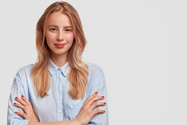 Young blonde woman wearing blue shirt