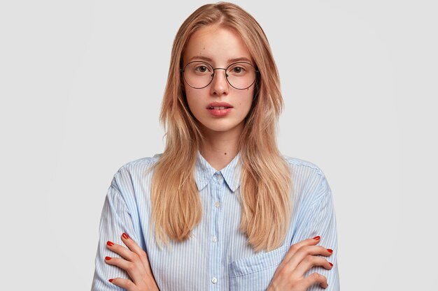 Young blonde woman wearing blue shirt