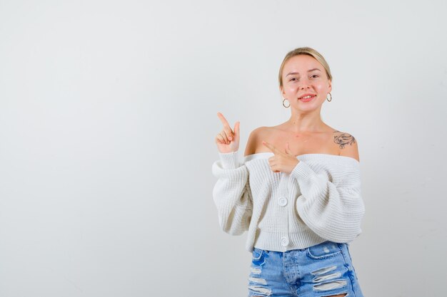 Young blonde woman in a white cardigan