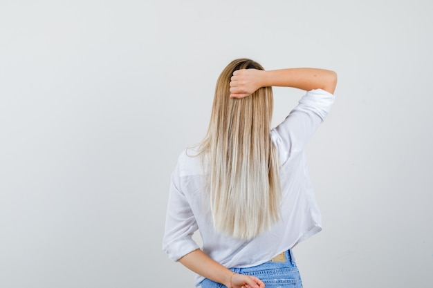 Young blonde woman in a white shirt