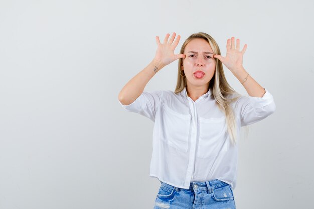 Young blonde woman in a white shirt