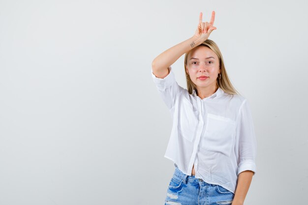 Young blonde woman in a white shirt