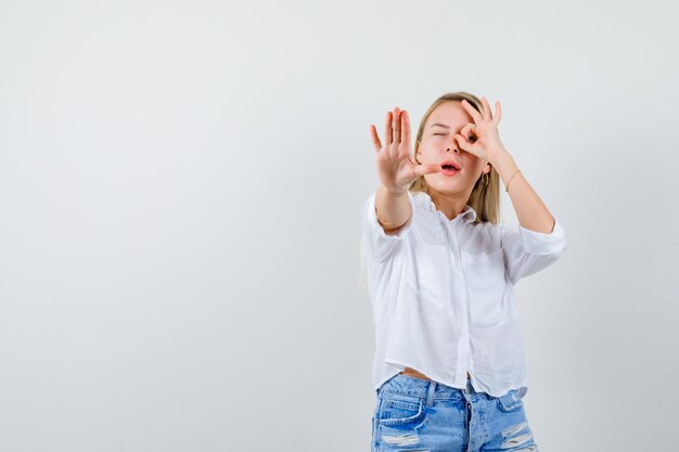 Young blonde woman in a white shirt